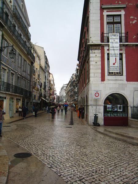 IMG_4560.JPG - Just before the rain - a street of restaurants where the waiters come out to hawk the place to every passing tourist (and here, like much of the world, a tall (for Portugal) redhead with a blond son is definitely a tourist - Ivo doesn't look Portuguese but with sunglasses on at least his dark hair gives him some cover).